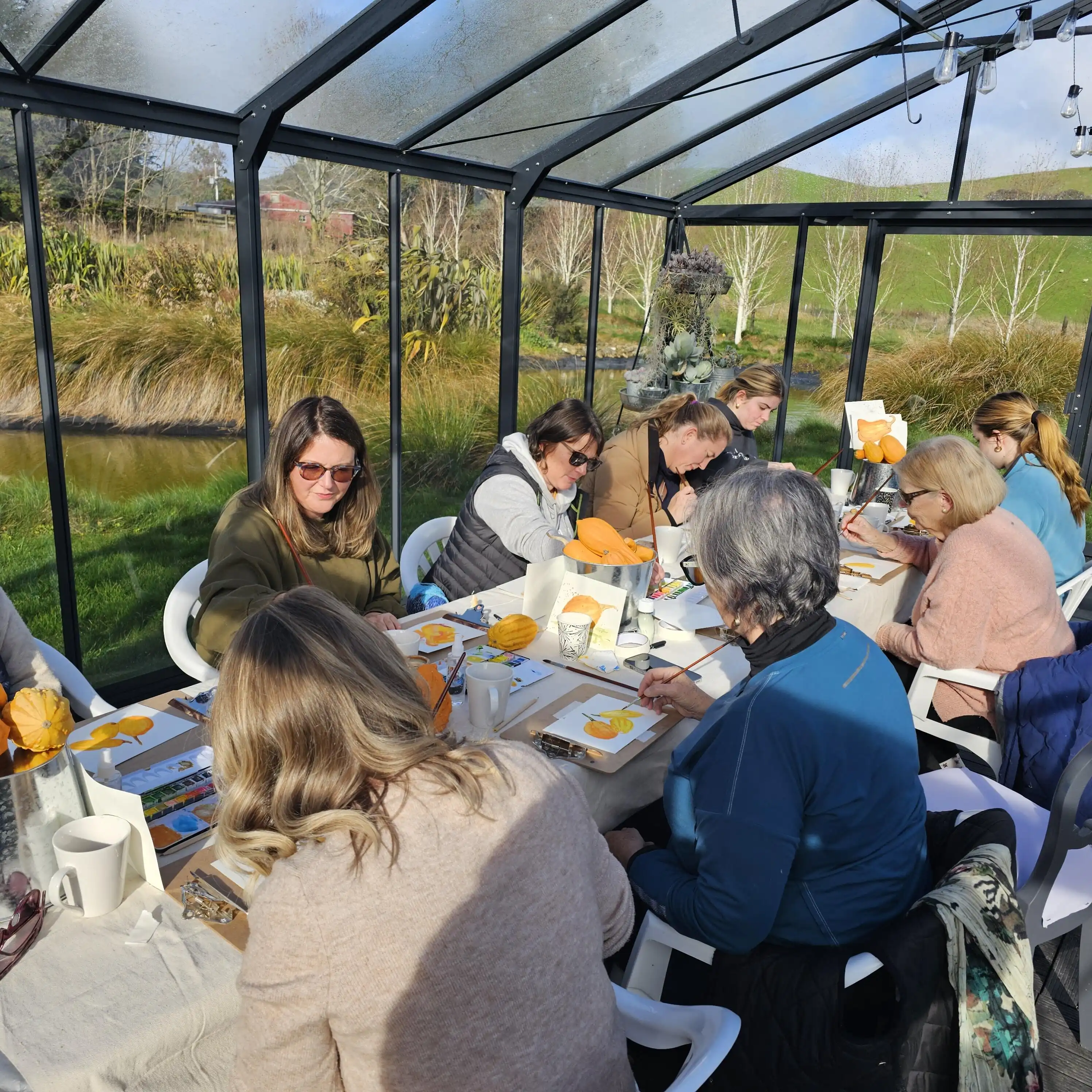 Artists sketching among flowers